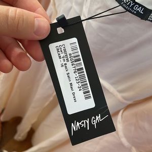 New with tags Nasty Girl ivory low back wrap satin dress US 12